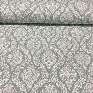 May include: A teal fabric with a white damask pattern. The fabric has a subtle sheen and a soft texture.