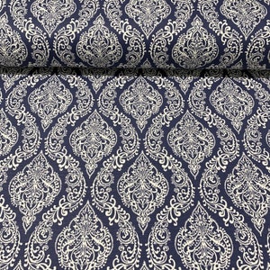 May include: A navy blue fabric with a white damask pattern. The fabric has a subtle texture and a repeating pattern of intricate floral designs.
