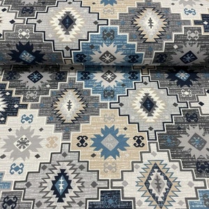 May include: A fabric with a geometric pattern in shades of blue, gray, and beige. The pattern features repeating diamond shapes and stars.