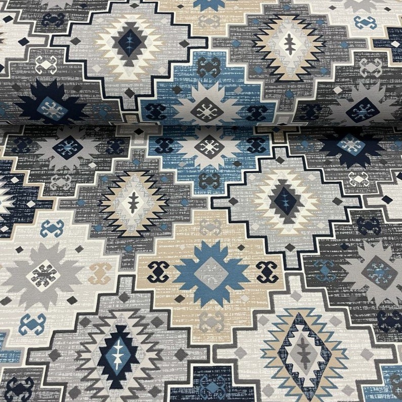 May include: A fabric with a geometric pattern in shades of blue, gray, and beige. The pattern features repeating diamond shapes and stars.