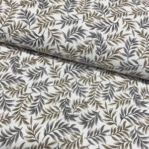 May include: White fabric featuring a repeating pattern of stylized leaves in grey and brown tones. The leaves are densely arranged, creating a natural, organic design. The fabric is folded, revealing its texture and drape. Ideal for textiles.
