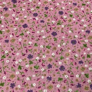 May include: Pink fabric with a small floral print in shades of white, purple, and brown.