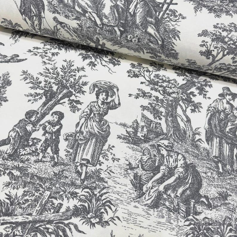 May include: A roll of fabric with a black and white toile de Jouy design. The fabric shows a detailed pastoral scene with figures in historical dress, trees, and buildings. The material has a soft, matte finish, suitable for sewing projects.