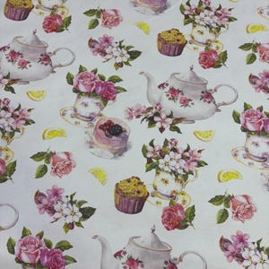 May include: White background with a repeating pattern of teapots, teacups, cupcakes, and cakes. The design includes pink roses, lemon slices, and floral arrangements. The teapots and teacups have floral designs.