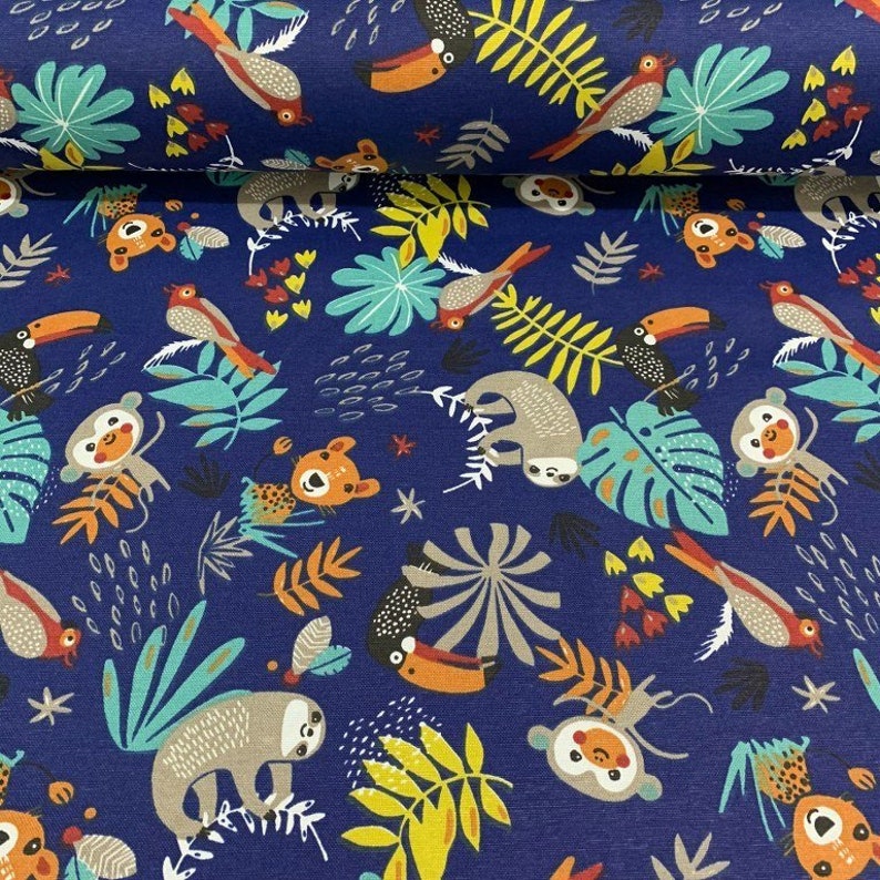 May include: A blue fabric with a repeating pattern of sloths, monkeys, toucans, and tropical leaves. The fabric is perfect for crafting projects, quilting, and sewing.