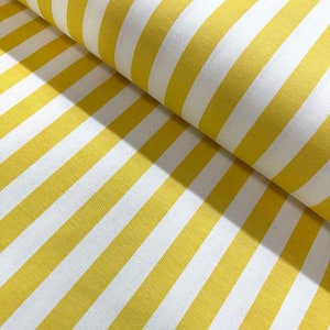 May include: Yellow and white striped fabric. The fabric has a smooth texture and is perfect for sewing projects.