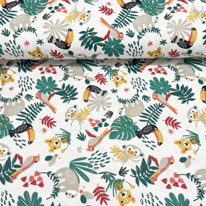 May include: White fabric with a repeating pattern of jungle animals, including toucans, sloths, monkeys, and parrots. The animals are surrounded by green leaves and red flowers.