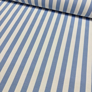 May include: A close-up of a fabric with a repeating pattern of diagonal blue and white stripes. The fabric is rolled up at the top, showing the texture and direction of the stripes. The stripes are of equal width.