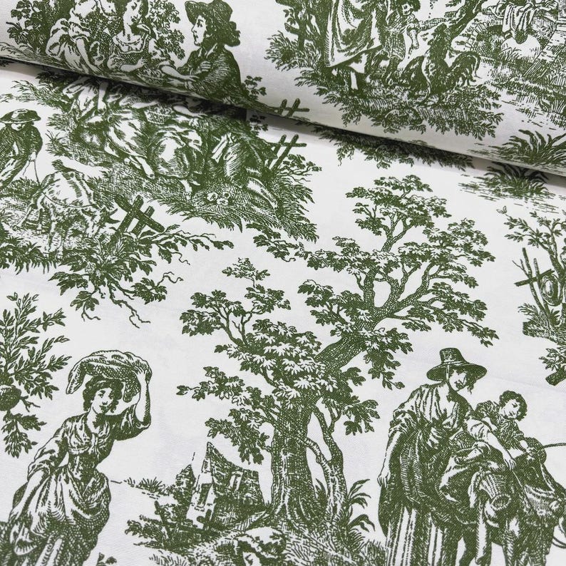 May include: White fabric featuring a green toile de Jouy pattern. The design shows rural scenes with figures, trees, and buildings. Suitable for home decor or clothing.