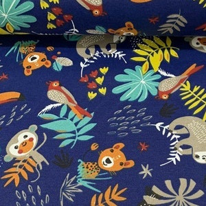 May include: A blue fabric with a repeating pattern of jungle animals and plants. The animals include monkeys, sloths, toucans, and birds. The plants include palm leaves, ferns, and flowers.