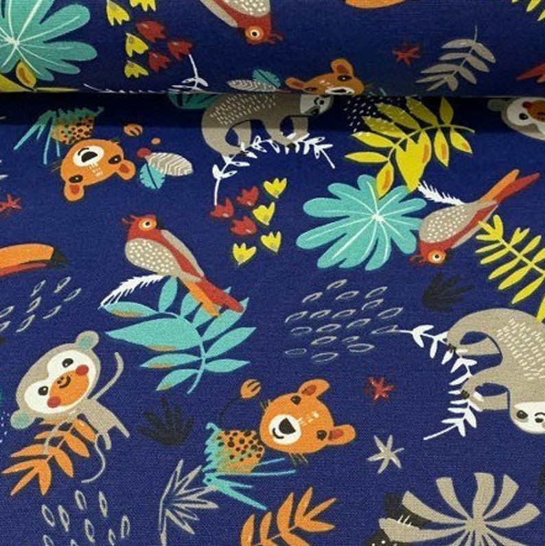 May include: A blue fabric with a repeating pattern of jungle animals and plants. The animals include monkeys, sloths, toucans, and birds. The plants include palm leaves, ferns, and flowers.