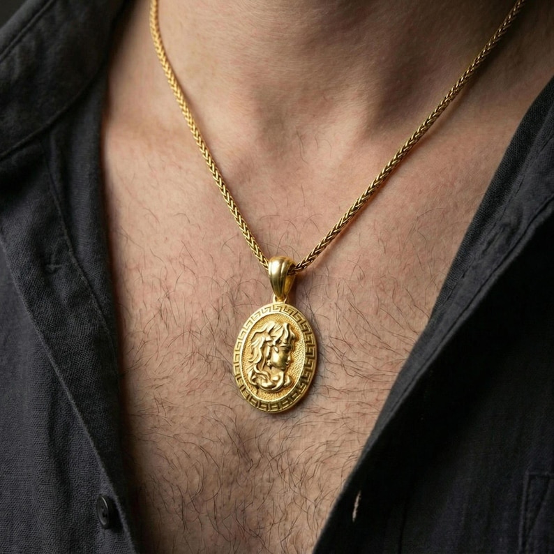 Gold plated Medusa coin pendant worn on neck, Greek mythology medallion necklace with Greek key border and raised portrait relief