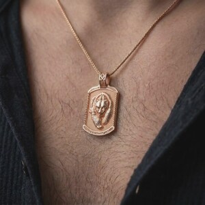 Rose gold plated bear family pendant worn on the chest, showcasing the parent bear and cub, textured medallion background, and meaningful wildlife-inspired necklace design.