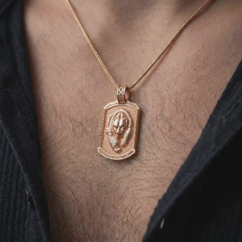 Rose gold plated bear family pendant worn on the chest, showcasing the parent bear and cub, textured medallion background, and meaningful wildlife-inspired necklace design.