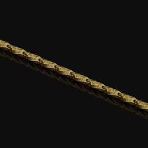 May include: A gold chain with a repeating pattern of interlocking links. The chain is made of a thick, durable metal and has a polished finish.