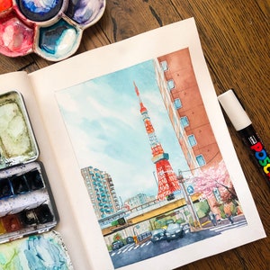 May include: Watercolour painting of a cityscape with a red and white tower in the background. The tower is surrounded by buildings and a street with cars. There are pink cherry blossoms in the foreground.