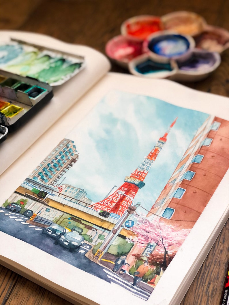 May include: Watercolour painting of the Tokyo Tower in Japan. The tower is red and white and is surrounded by buildings and trees. There are cars on the street below the tower.