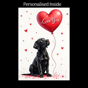 May include: A Valentine's Day card with a black Labrador gazing at a red heart-shaped balloon with "Love You" written on it. The card has a white background with red hearts and the text "Personalised Inside".