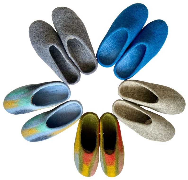 May include: A set of ten colorful wool slippers arranged in a circle. The slippers are in various shades of blue, gray, green, and yellow.