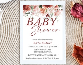 Könnte beinhalten: Eine weiße Babyparty-Einladung mit burgunderfarbenem Text und floralen Akzenten. Die Einladung lautet "BABY Shower" und enthält Details für Kate Flaints Babyparty, einschließlich Datum, Uhrzeit und Ort. Die Einladung ist mit einem floralen Design verziert.