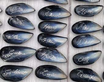 Beach-Wedding Place Names on Mussel Shells Decorated With Calligraphy Ink for Larger Weddings