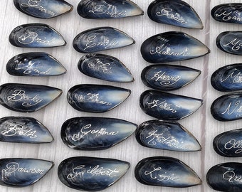 Beach-Wedding Place Names with Blue Mussel Shells & Calligraphy Ink for 100 Guests or Less.