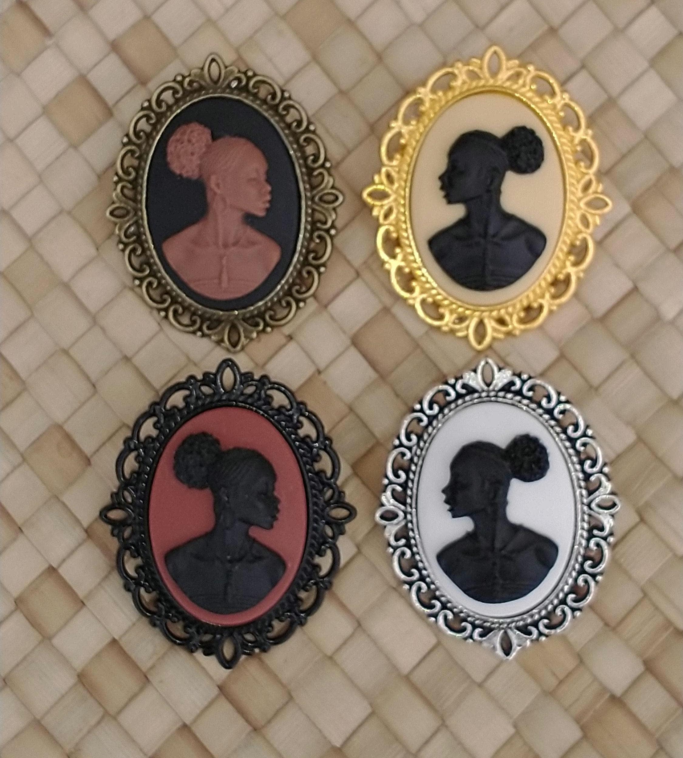 Cameo Broaches in a Variety of Finishes; African Silhouette Cameo Brooches; Coquette Pendants: Antique Brass, Antique Silver & Black Brass