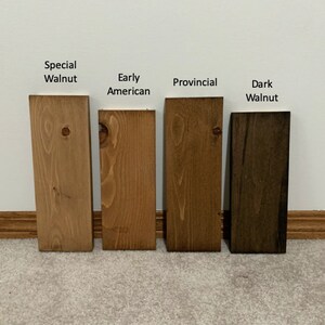 May include: Four wood samples stained in different colors: Special Walnut, Early American, Provincial, and Dark Walnut.