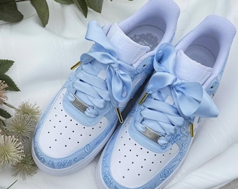 blue nike shoes with flowers