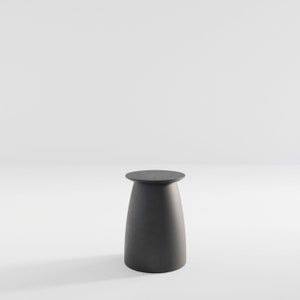 May include: A black, round-topped side table with a slightly flared base. The table is made of a smooth, solid material.