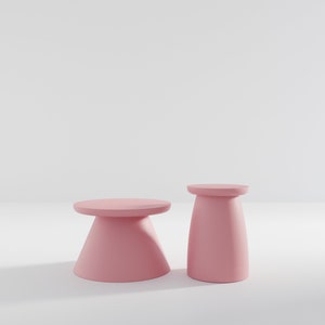 May include: Two pink pedestal stands, one tall and one short, on a white background.
