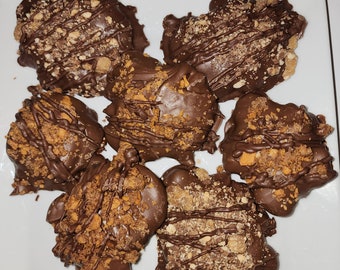 Chocolate clusters, chocolate candy, large chocolate patties, delicious chocolate with nuts