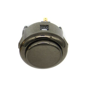 May include: A black metal arcade button with a round, slightly raised, black button top.