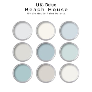 May include: A paint colour palette for a beach house, featuring nine paint colours in various shades of blue, white, and grey. The palette is labelled "UK-Dulux Beach House Whole House Paint Palette".