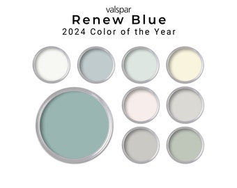 May include: A collection of paint color swatches, including the 2024 Valspar Color of the Year, Renew Blue. The swatches are arranged in a circle, with the Renew Blue swatch in the center.