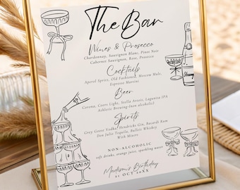 Puede incluir: Un letrero con marco dorado con las palabras "The Bar" en escritura elegante. El letrero enumera vinos, cócteles, cerveza, licores y bebidas sin alcohol. El letrero es para el cumpleaños de Madison, 21 de octubre.
