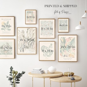 May include: A gallery wall arrangement of eight framed art prints in various sizes, including 8x10, 11x14, and 16x20 inches. The prints feature botanical, floral, and architectural illustrations in muted pastel tones, displayed on a plain wall.