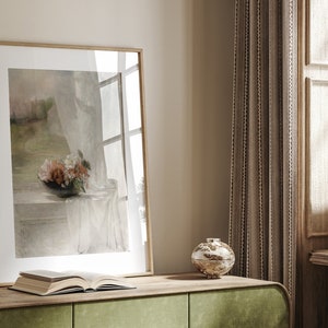 May include: A framed painting of a still life with a bouquet of flowers in a vase on a table with a white cloth. The painting is in a light wood frame and is hanging on a wall.