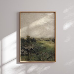May include: A framed painting of a landscape with a cloudy sky and a field of green grass. The painting is in a wooden frame.