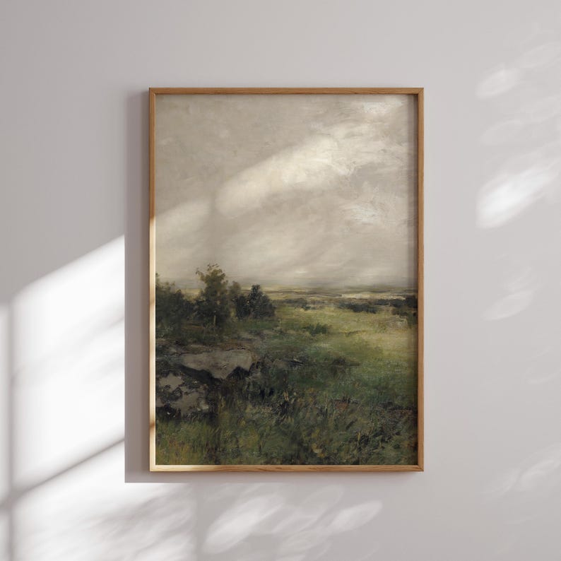 May include: A framed painting of a landscape with a cloudy sky and a field of green grass. The painting is in a wooden frame.