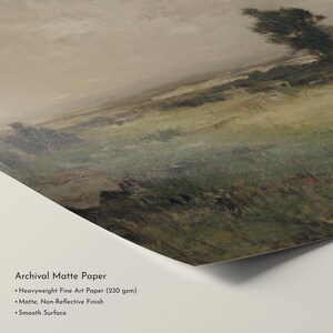 May include: A landscape art print on archival matte paper. The artwork depicts a field with green and brown tones under a cloudy sky. The paper has a matte, non-reflective finish and a smooth surface.