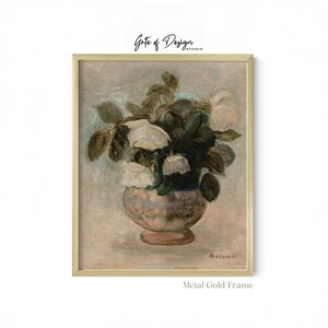 May include: A framed wall art print featuring an oil painting of white roses in a rounded vase. The artwork displays muted tones of gray, green, and white. The piece is enclosed in a thin, metallic gold frame. The text Gate of Design Studio appears above the frame, and Metal Gold Frame is written below it.