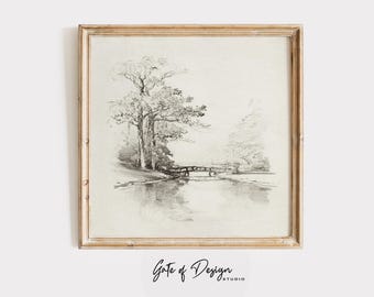 May include: A framed black and white landscape print featuring a serene waterscape with a small bridge and trees. The artwork is a pencil sketch, with the text "Gate of Design" at the bottom.
