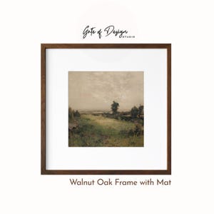 May include: A framed landscape print featuring a serene field scene with a muted color palette. The artwork is set within a walnut oak frame and a white mat, with the text "Gate of Design Studio" at the top.