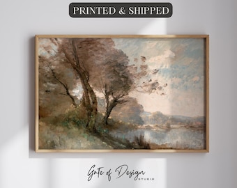 May include: A landscape painting in a wooden frame depicting trees along a riverbank under a cloudy sky. The artwork features muted brown, green, and blue tones with visible brushstrokes. Above the frame is the text PRINTED & SHIPPED.