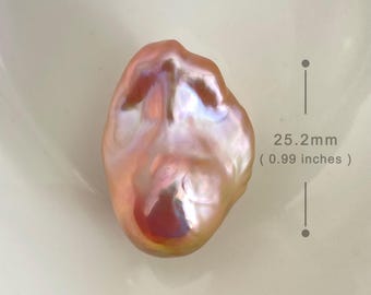 May include: A large, irregular, iridescent pink pearl with a textured surface. The pearl measures 0.99 inches (25.2 mm) in diameter. BPA-0414.