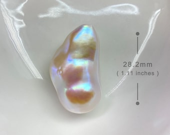 May include: A large, iridescent baroque pearl, approximately 1.11 inches (28.2mm) in length, rests in a white dish. The pearl displays a mix of colors, including pink, gold, and blue, with a smooth, irregular shape. The text "BWA-0158" is visible.