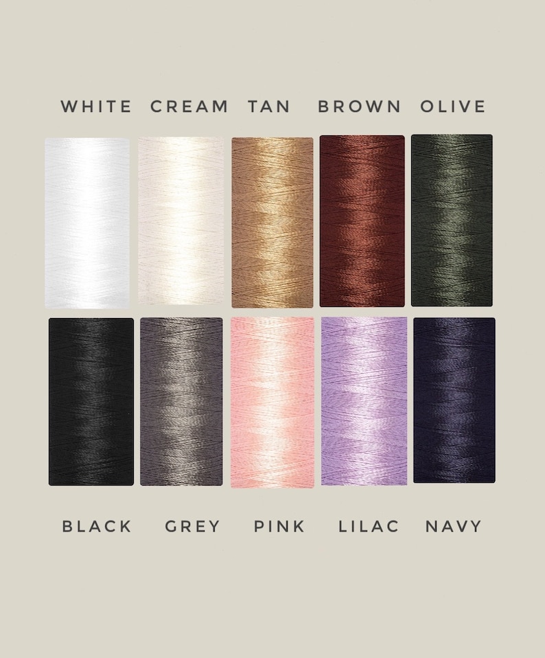 May include: A color chart of thread spools in various colors, including white, cream, tan, brown, olive, black, grey, pink, lilac, and navy.