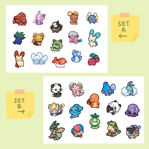 May include: Two sets of colorful cartoon stickers featuring various animal and creature designs. Set A includes a crab, a bird, a cat, a sheep, a rabbit, a fish, a penguin, and a strawberry. Set B includes a panda, a bunny, a fish, a cloud, a frog, a plant, a dragon, a bird, and a ghost.