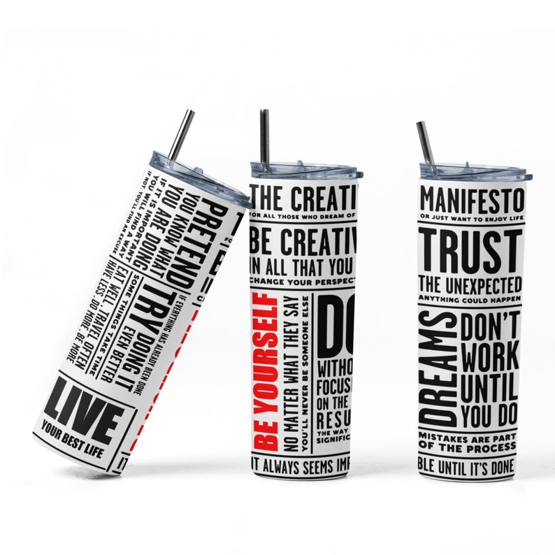 May include: Three stainless steel tumblers with motivational quotes printed on them. The quotes are in black and red text on a white background. The tumblers are all the same size and shape, and they have a lid and a straw. The quotes are: "Live Your Best Life", "Be Yourself", and "Manifest Trust".